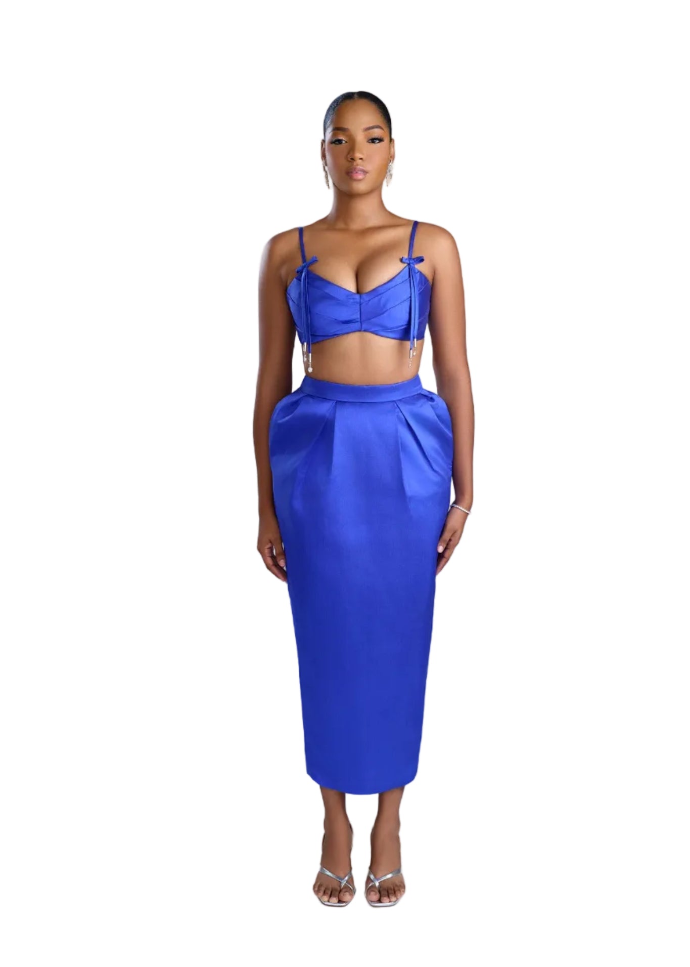 Woman wearing a blue outfit on a light background
