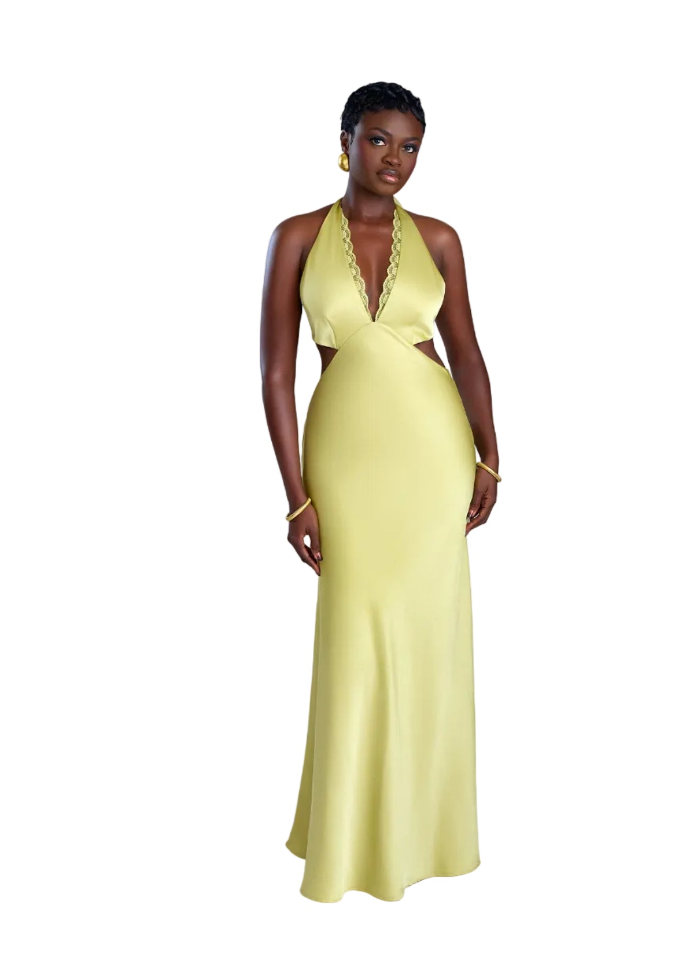 Woman wearing a yellow evening gown on a white background