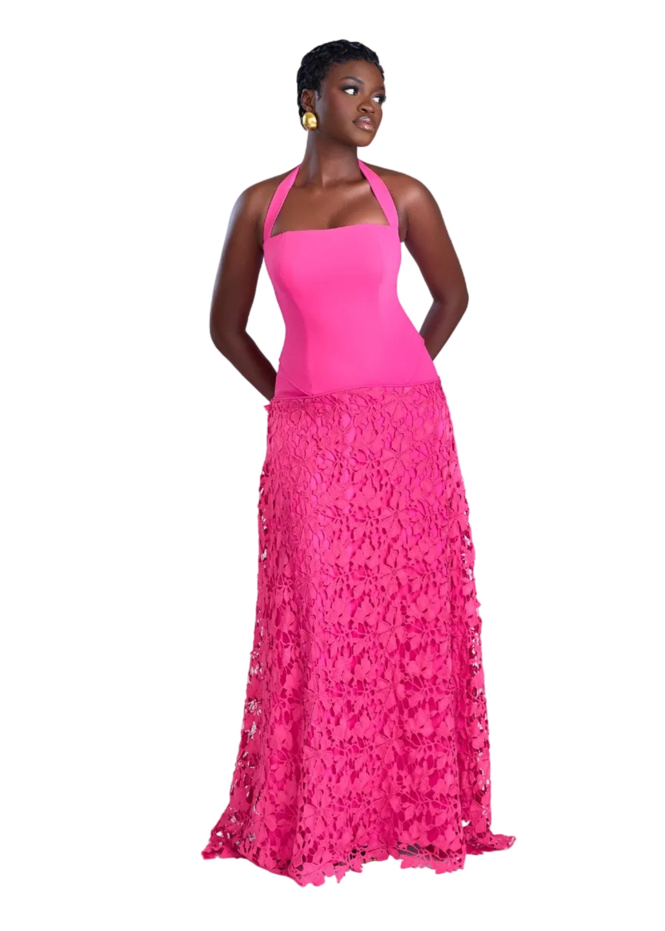 Woman wearing a pink dress with a floral skirt on a white background