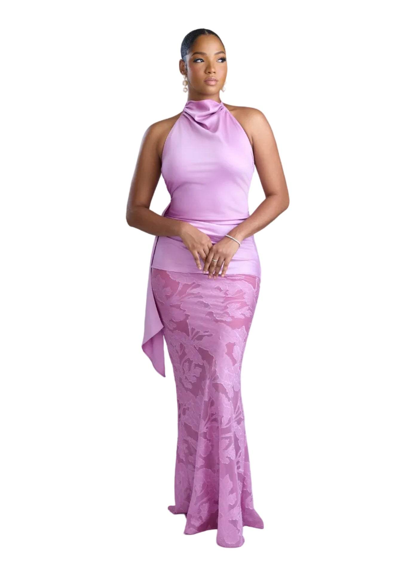Woman wearing a pink dress against a light background