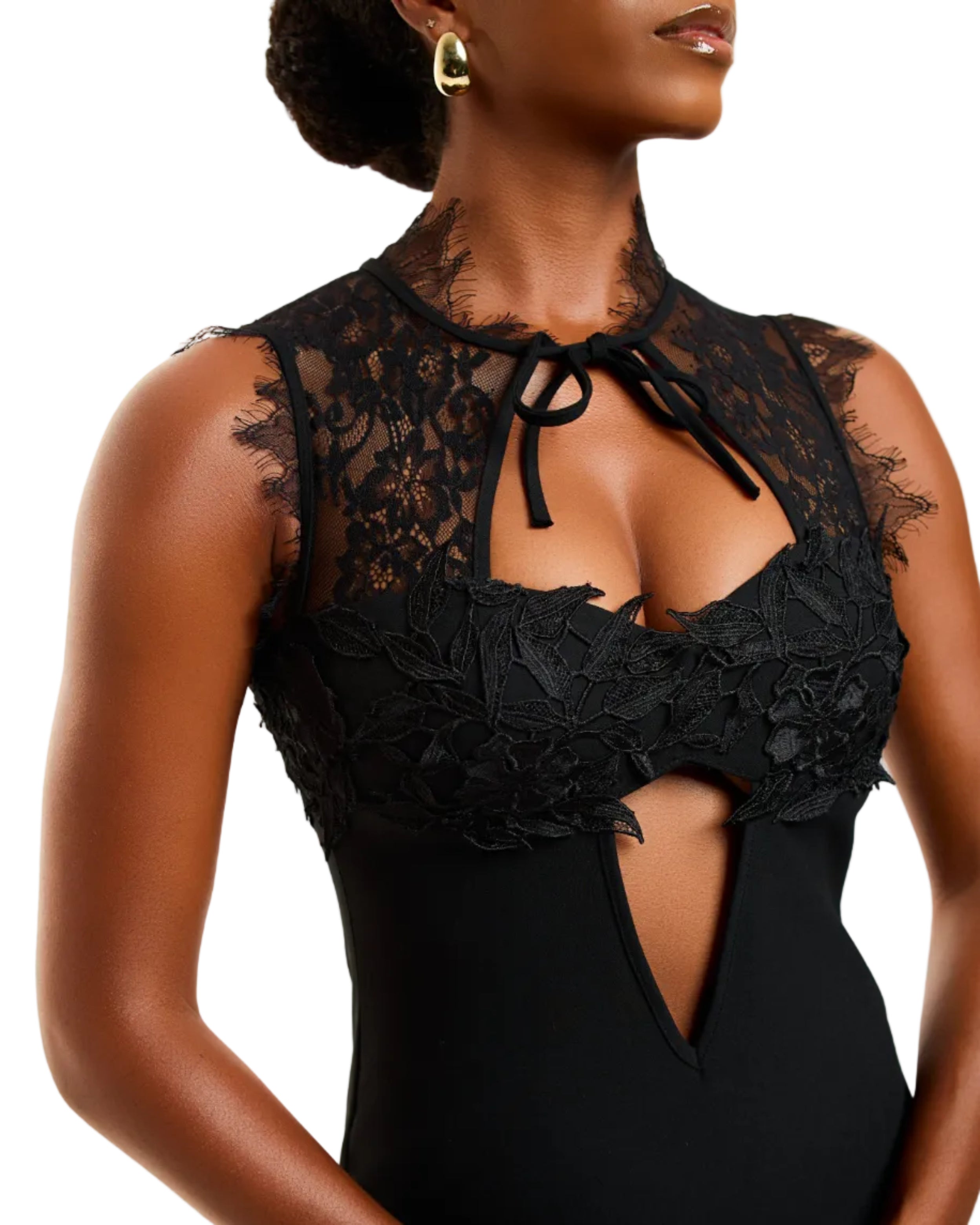 Black lace bodysuit worn by a model on a white background
